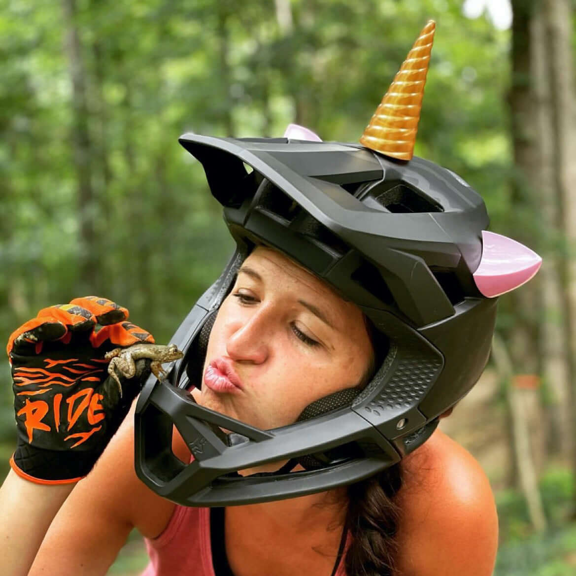 Unicorn horn and pink cat ears on a bicycle helmet
