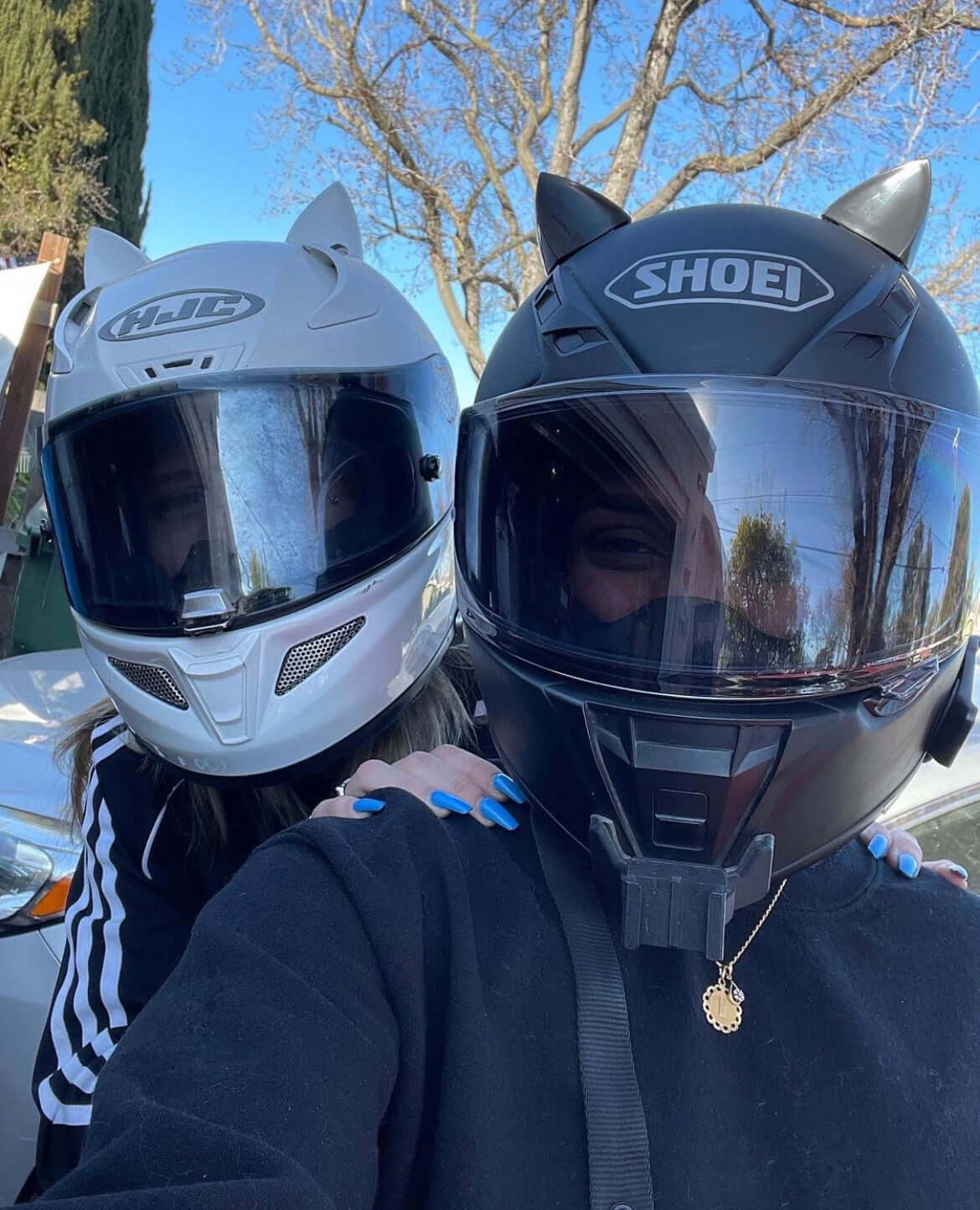 White and black cat ears on motorcycle helmet