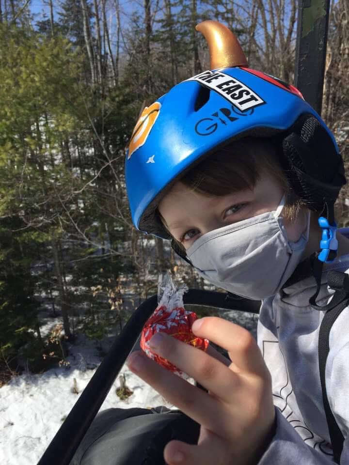 Small gold helmet horns on a ski helmet worn by a child