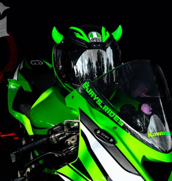 Motorcycle helmet with small green horns from Helmet Flair