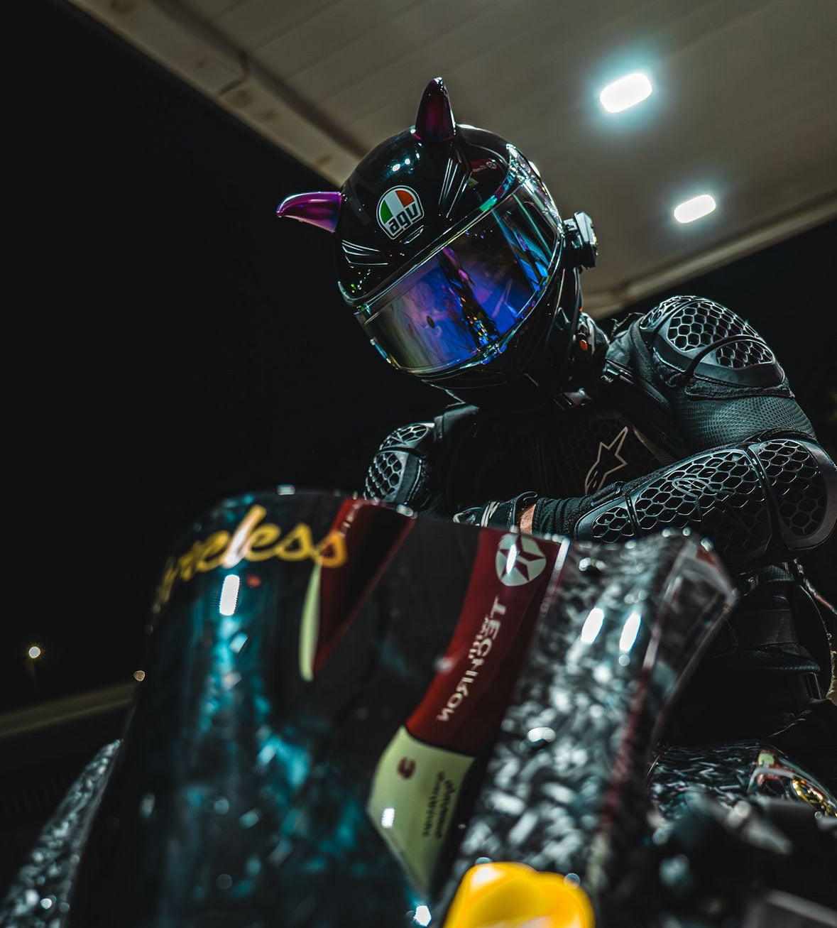 Motorcycle rider wearing a helmet with horn accessories by Helmet Flair for visibility and style