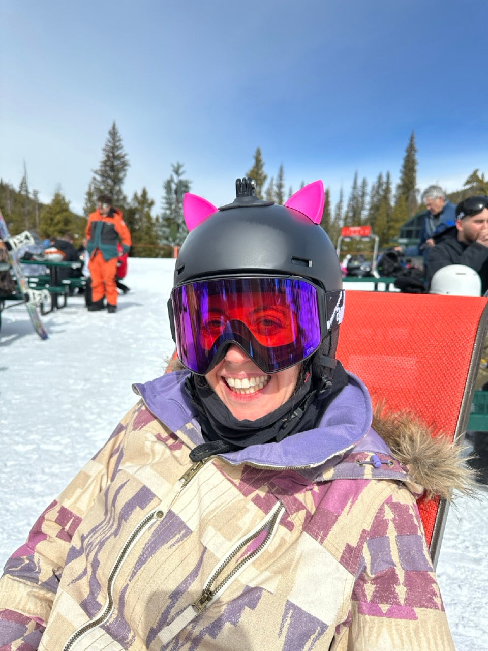 Soft foam cat ears compressed by a hand on a helmet,