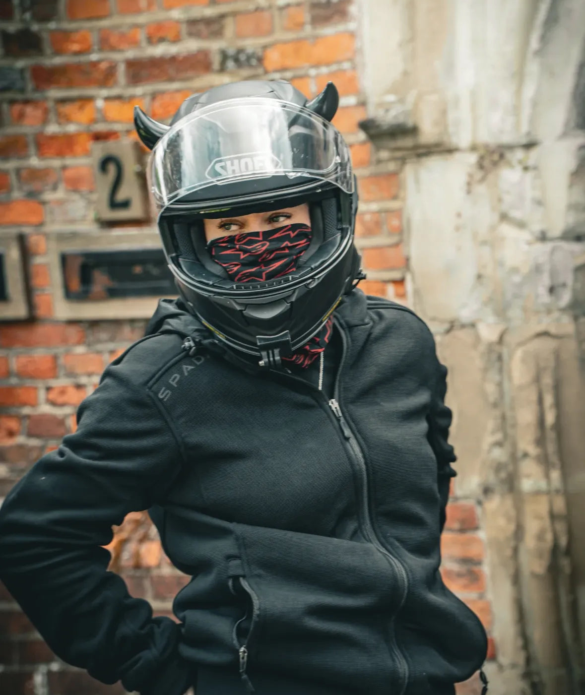Motorcycle rider with small black horns from Helmet Flair
