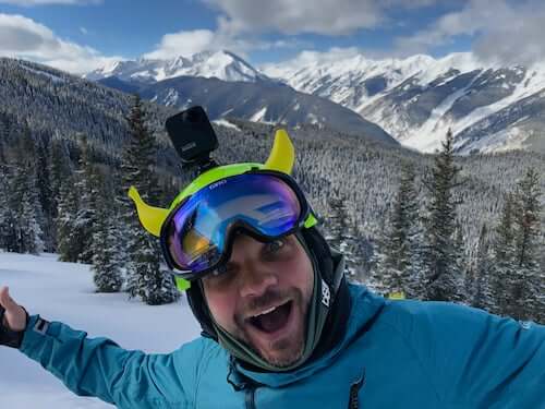 Banana on a ski helmet with mountains in the background