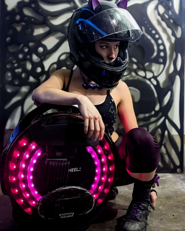 Purple cat ears on a helmet for an electric unicycle