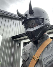 Large black helmet horns on a motorcycle helmet mounted like Loki horns