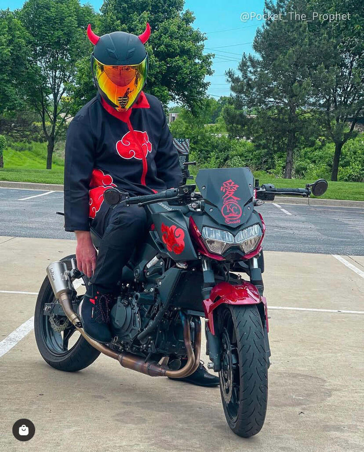 Large red devil horns on a motorcycle helmet