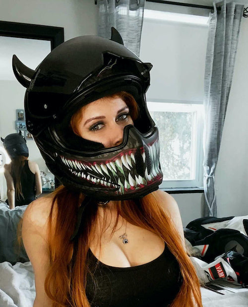 Small black devil horns on a Ruroc motorcycle helmet